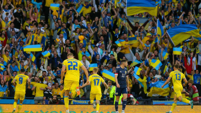 Ukraine players celebrate a World Cup qualifying playoff win in Scotland